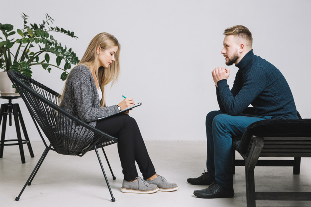 female-psychologist-listening-depressed-male-patient-writing-down-notes-clipboard_23-2148036682